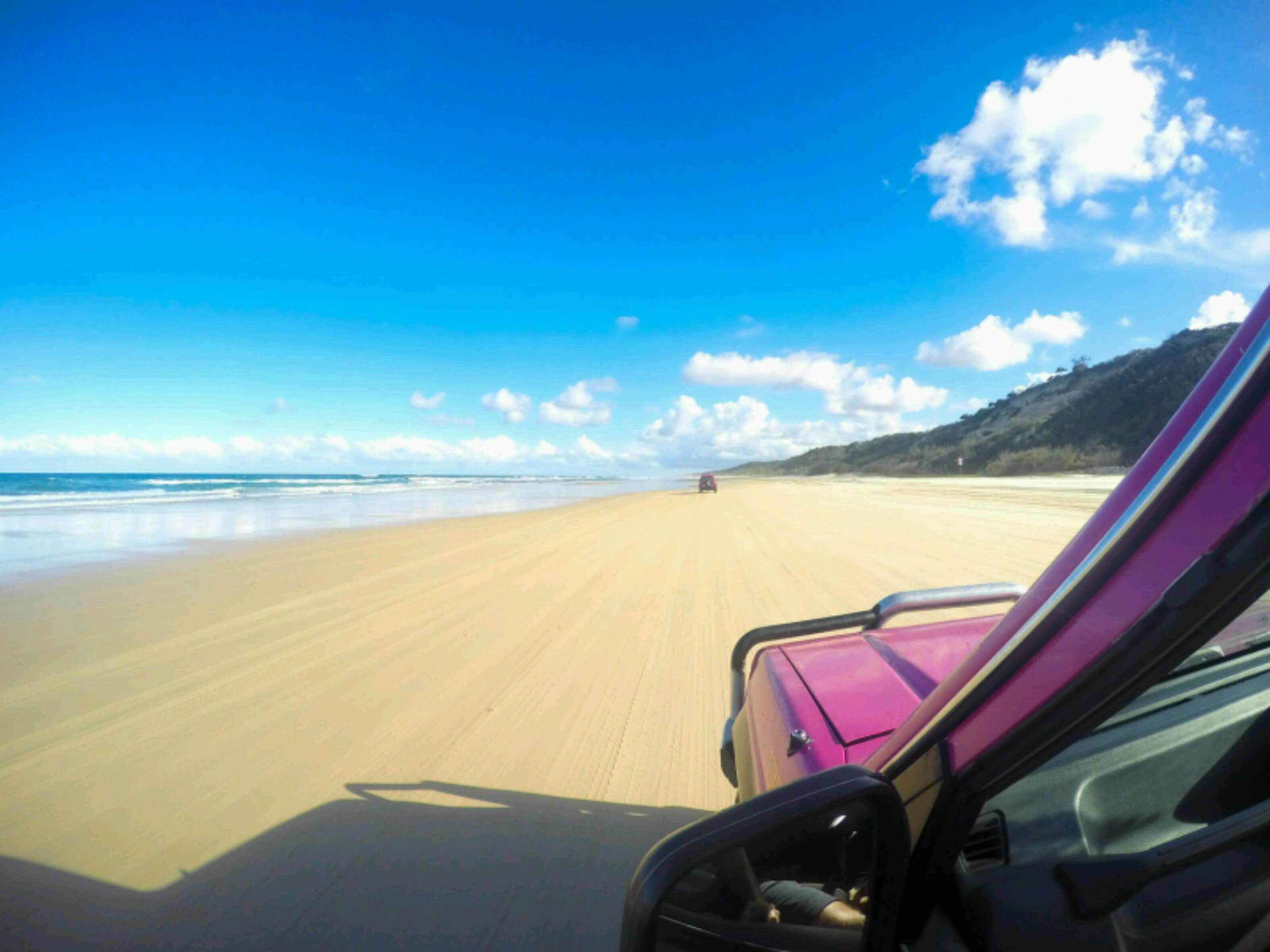 Cruising up 75 mile beach on Fraser Island in our pink 4x4