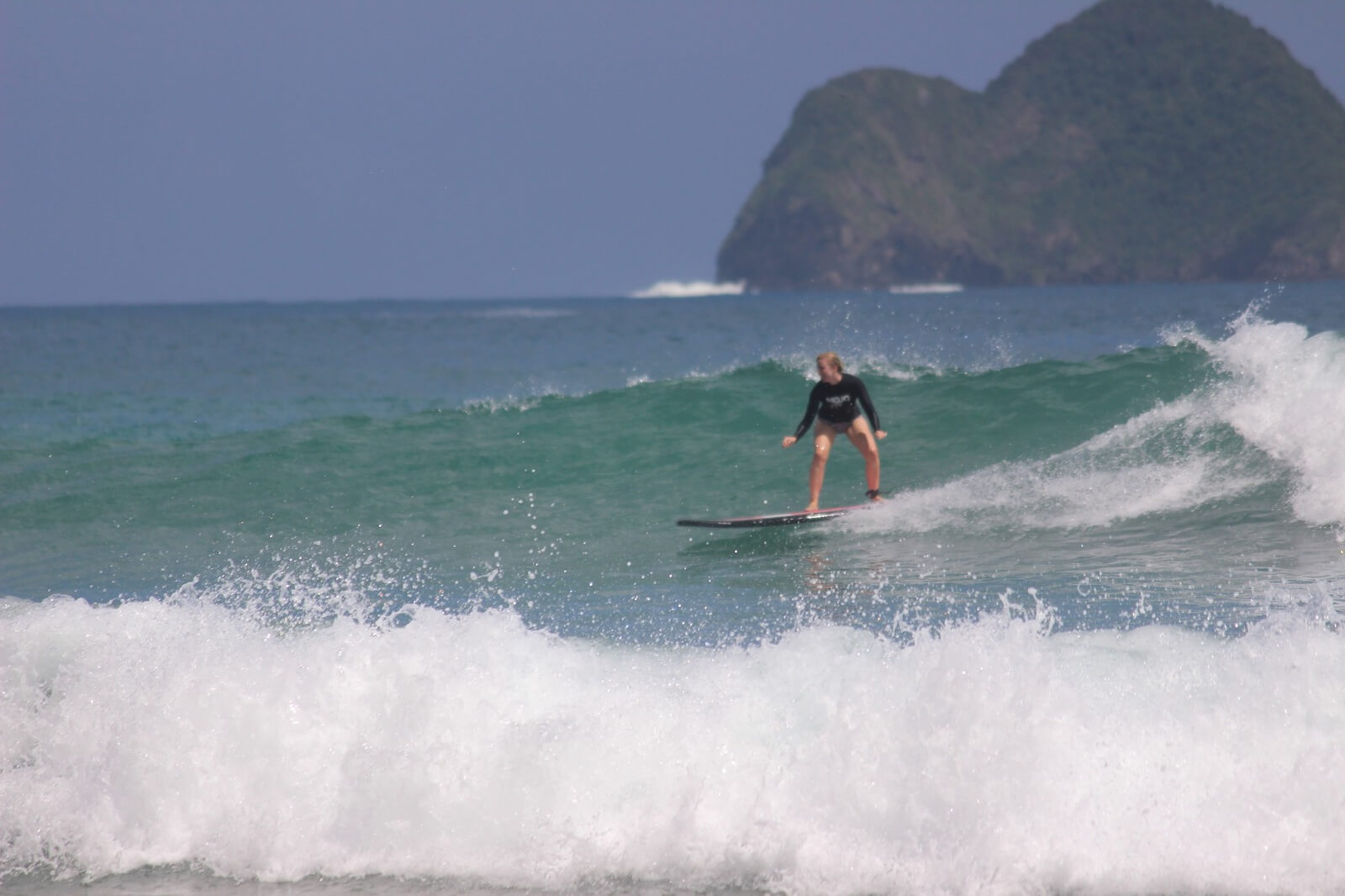 Surfing at the beautiful Red Island in Java 
